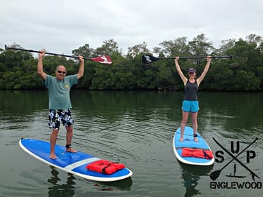 Paddle board lessons include time on land and in the water practicing your skills